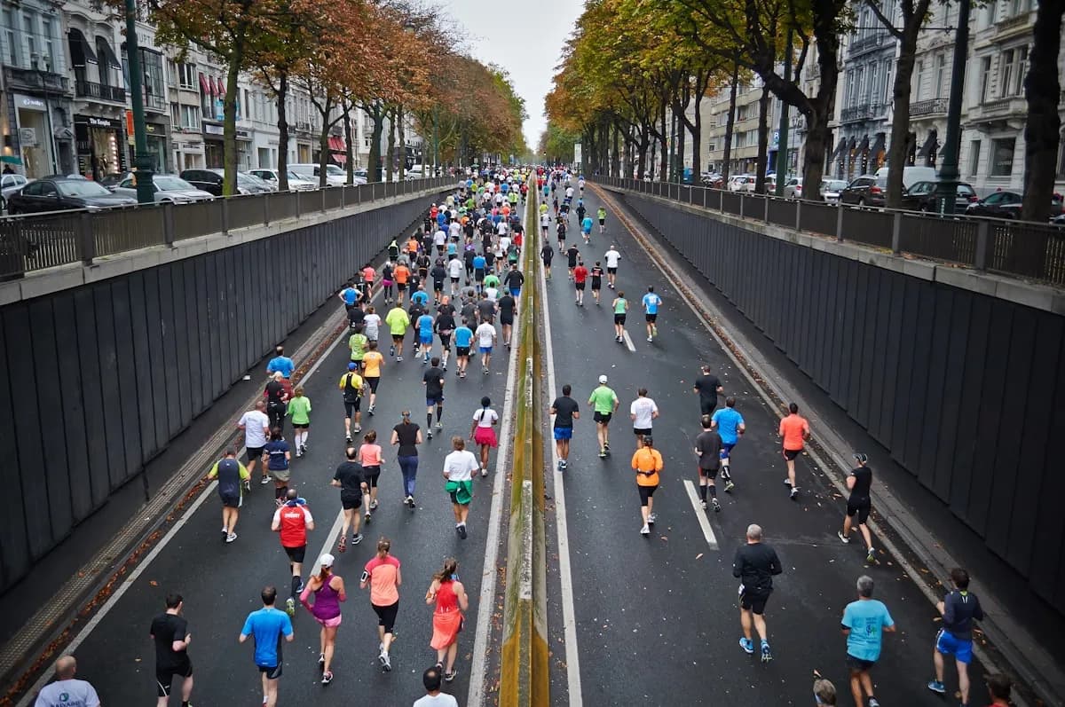 Runners crossing marathon finish line